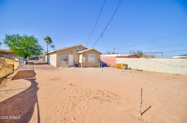 505 W 13th St, Casa Grande, AZ 85122 - back of house featuring stucco siding and a fenced backyard