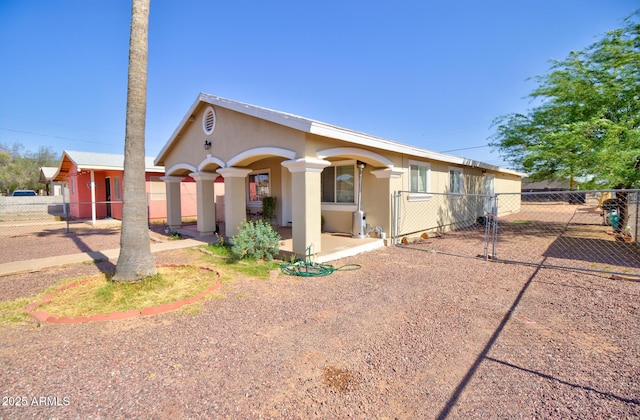 505 W 13th St, Casa Grande, AZ 85122 - view of front of property featuring a gate and stucco siding