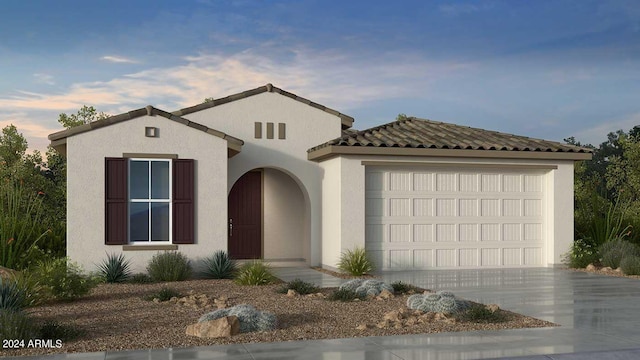 mediterranean / spanish-style home featuring a garage