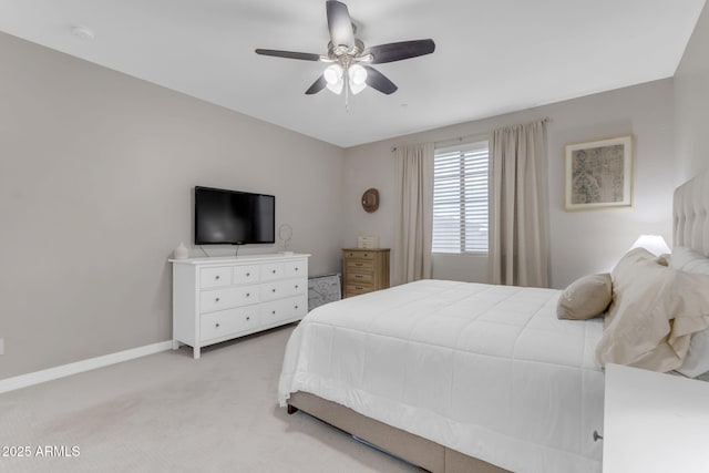 bedroom featuring light carpet and ceiling fan