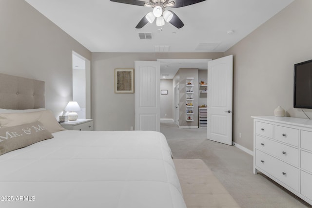 bedroom with light colored carpet and ceiling fan