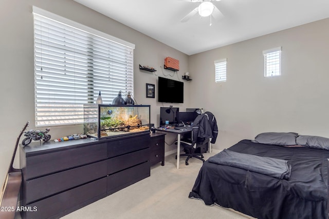 bedroom featuring light carpet and ceiling fan