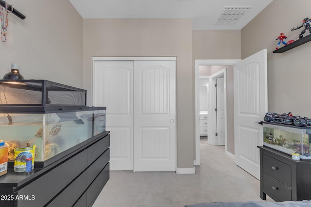 carpeted bedroom with a closet