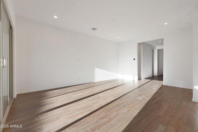 unfurnished room featuring wood-type flooring