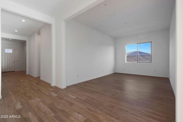 empty room featuring wood-type flooring