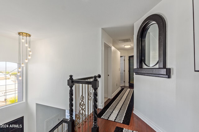 corridor with dark wood-type flooring