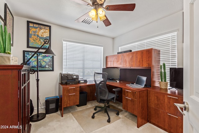 carpeted office featuring ceiling fan