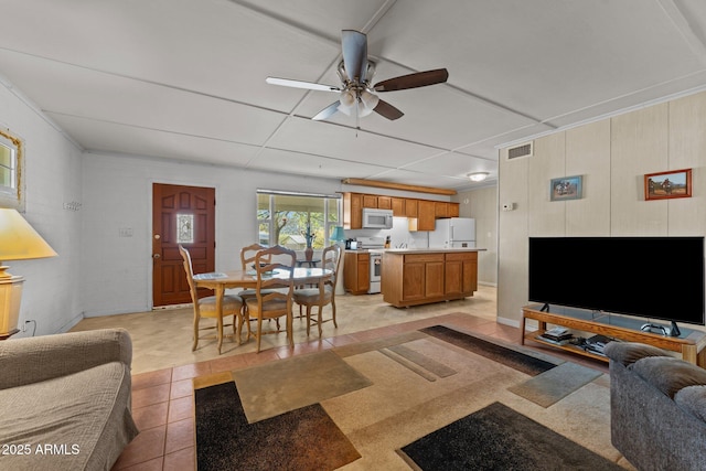 34381 S Vladimir St, Black Canyon City, AZ 85324 - living area with light tile patterned flooring, a ceiling fan, and visible vents