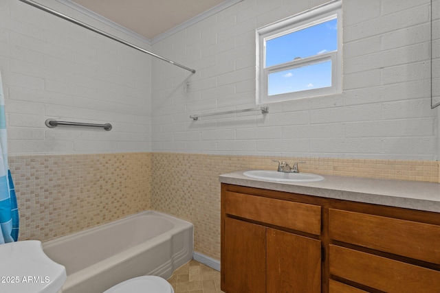 34381 S Vladimir St, Black Canyon City, AZ 85324 - full bathroom featuring tile walls, shower / bath combo with shower curtain, ornamental molding, toilet, and vanity