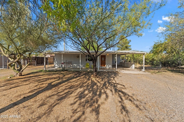 34381 S Vladimir St, Black Canyon City, AZ 85324 - single story home with fence, dirt driveway, a patio area, and an attached carport