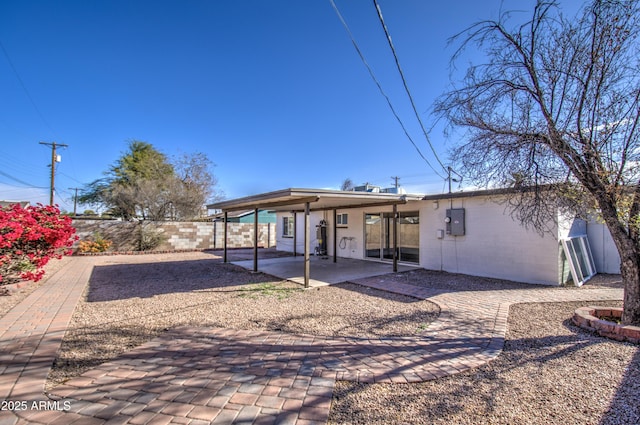 back of property featuring a patio area