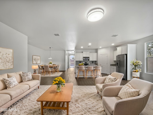 living room with dark hardwood / wood-style floors