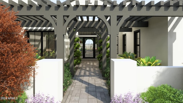 property entrance featuring a gate and stucco siding