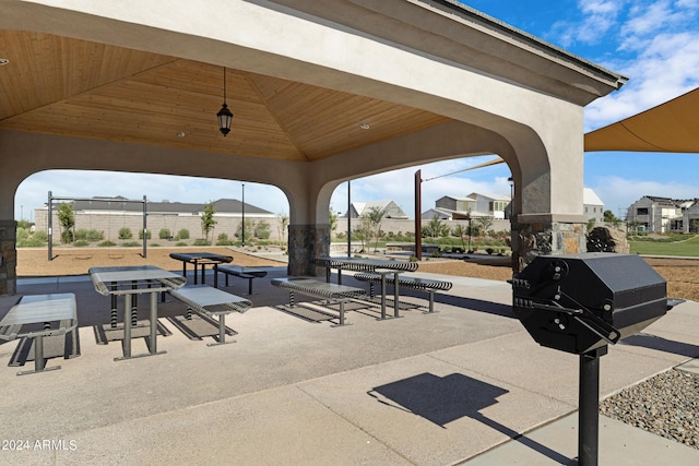 surrounding community with a gazebo and a patio area