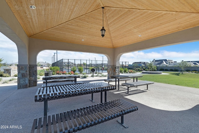 view of property's community featuring a patio and fence