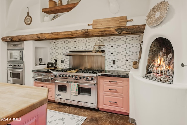 kitchen with decorative backsplash and stainless steel appliances