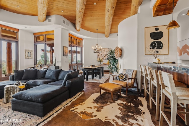 living room with beam ceiling, a chandelier, wood ceiling, and a towering ceiling