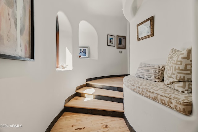 stairway featuring hardwood / wood-style floors