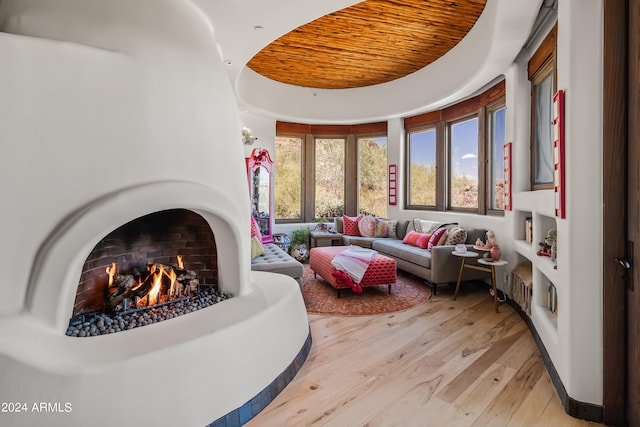 interior space with light hardwood / wood-style floors and wood ceiling