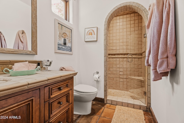 bathroom featuring vanity, toilet, and walk in shower