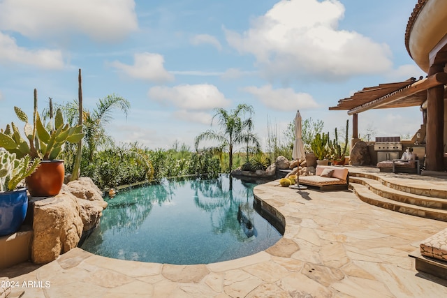 view of swimming pool featuring a pergola and a patio area