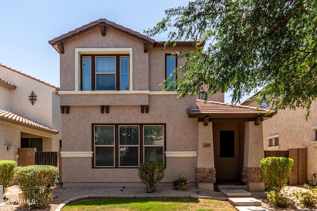 3449 E Sheffield Rd, Gilbert, AZ 85296 - view of front of house featuring a tiled roof, fence, and stucco siding