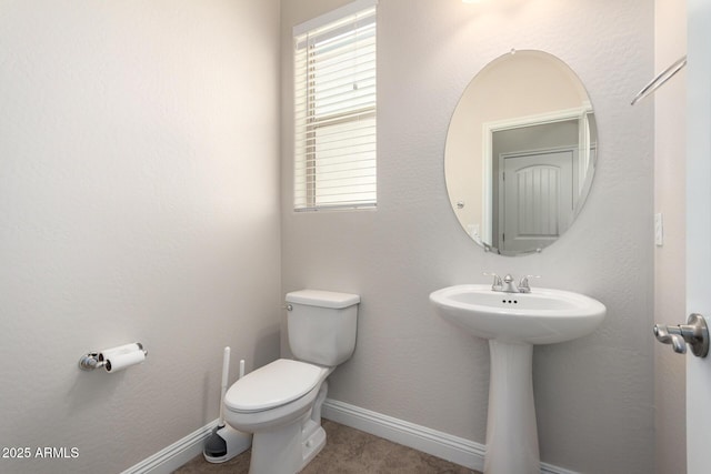 3449 E Sheffield Rd, Gilbert, AZ 85296 - half bathroom featuring toilet, a sink, and baseboards