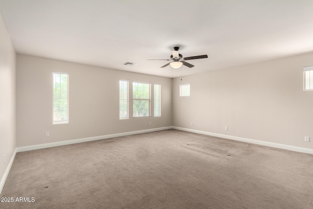 3449 E Sheffield Rd, Gilbert, AZ 85296 - empty room featuring a ceiling fan, plenty of natural light, and light colored carpet