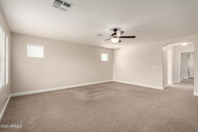3449 E Sheffield Rd, Gilbert, AZ 85296 - empty room with arched walkways, a ceiling fan, baseboards, and carpet flooring