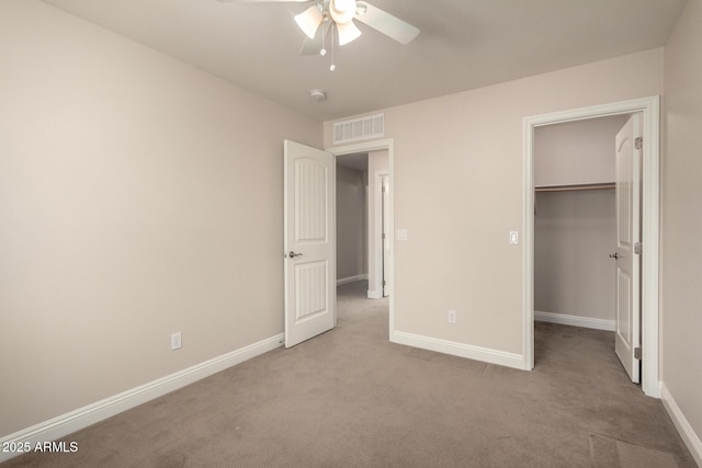 3449 E Sheffield Rd, Gilbert, AZ 85296 - unfurnished bedroom featuring carpet floors, baseboards, a spacious closet, ceiling fan, and a closet
