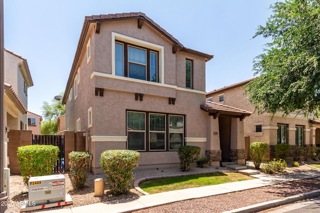 3449 E Sheffield Rd, Gilbert, AZ 85296 - view of front of house featuring stucco siding, a tiled roof, and fence
