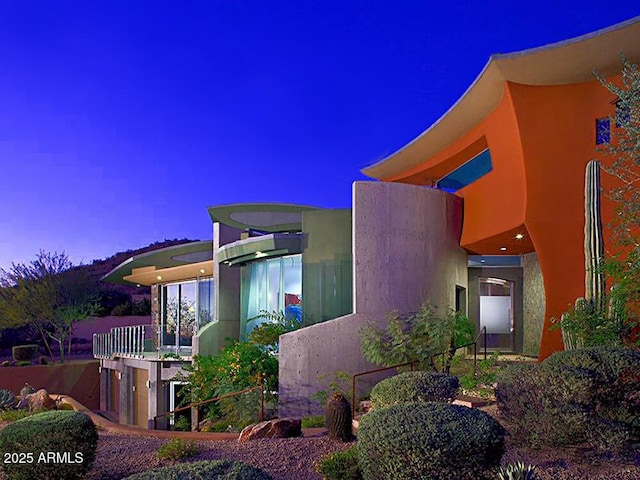 view of property exterior at dusk