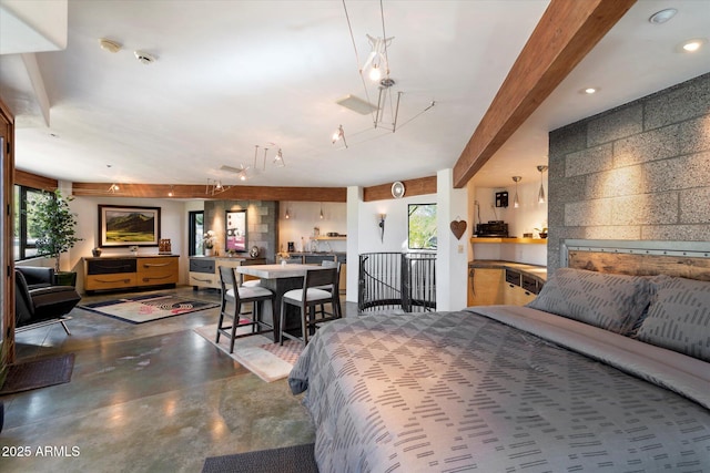 bedroom with concrete floors and beam ceiling