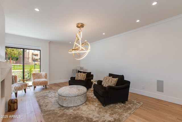 2737 E Arizona Biltmore Cir Unit 8, Phoenix, AZ 85016 - sitting room with light wood-type flooring, ornamental molding, baseboards, a chandelier, and recessed lighting