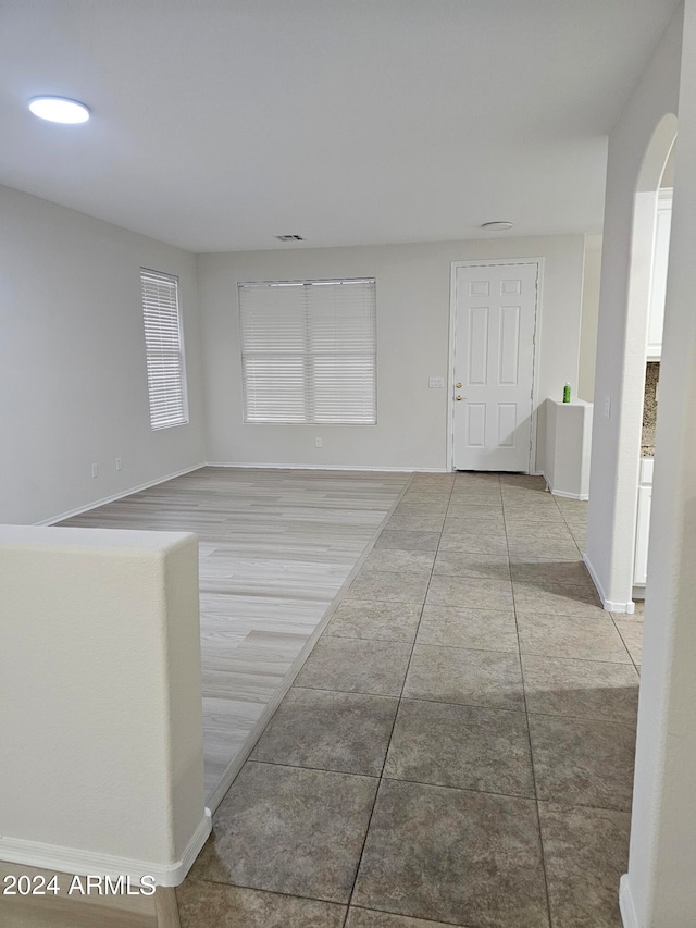 hallway with light tile patterned flooring