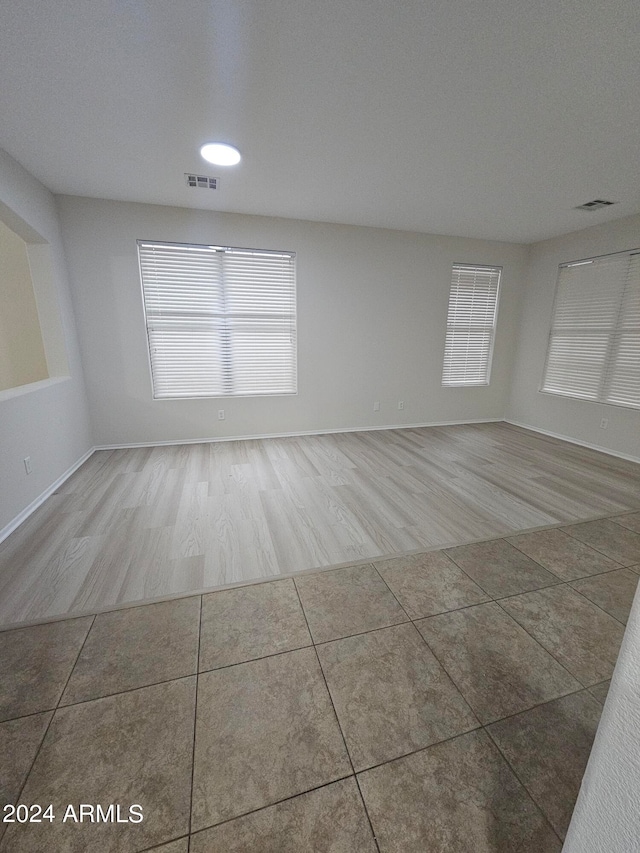 empty room with hardwood / wood-style floors