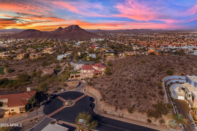 aerial view at dusk with a residential view and a mountain view