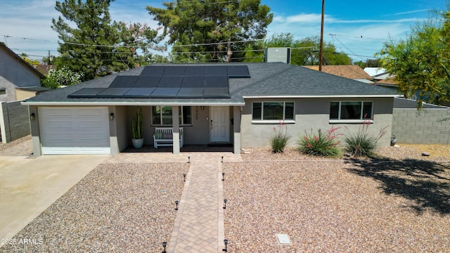 ranch-style house featuring driveway, fence, a garage, stucco siding, and a porch