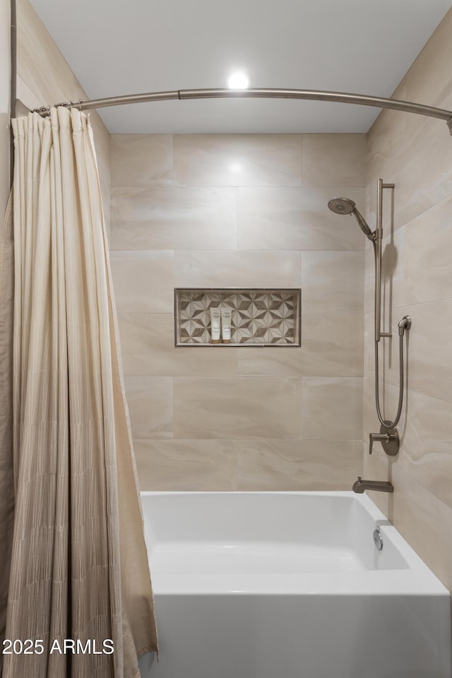 bathroom featuring shower / bathtub combination with curtain