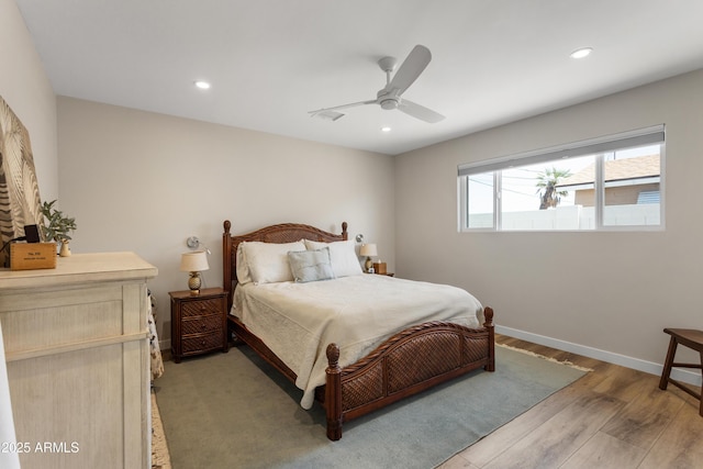 bedroom with light wood-type flooring, baseboards, ceiling fan, and recessed lighting
