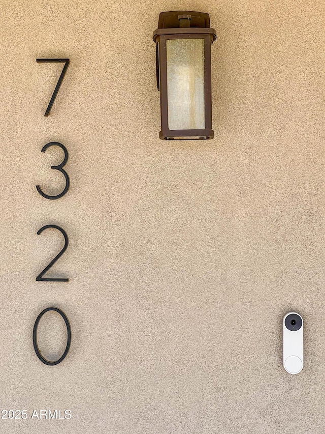 exterior details featuring stucco siding