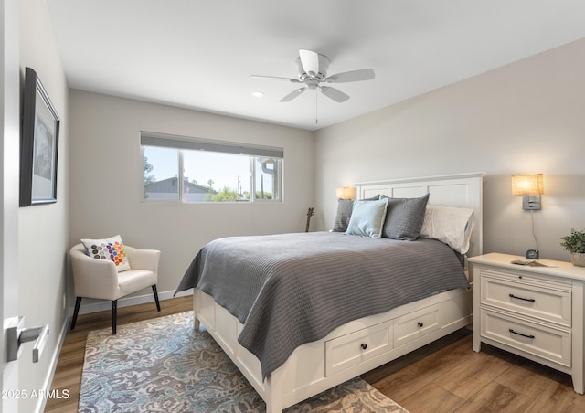bedroom featuring baseboards, dark wood-style floors, a ceiling fan, and recessed lighting