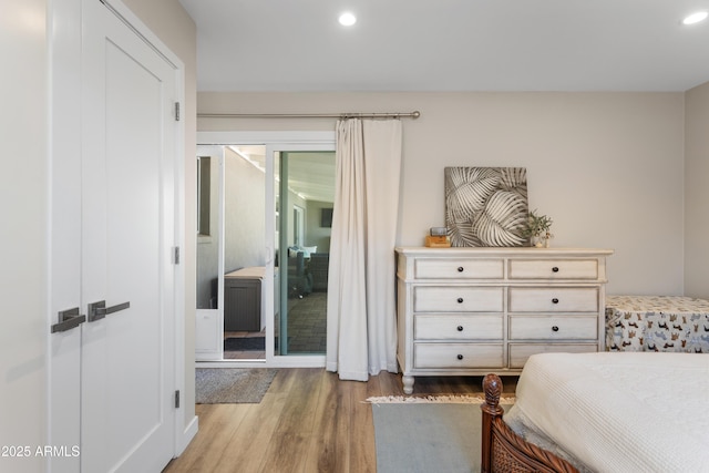 bedroom featuring recessed lighting and wood finished floors