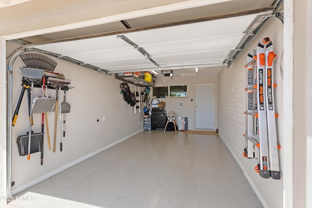garage featuring baseboards and a garage door opener