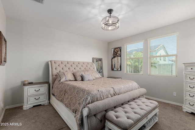 15276 W Latham St, Goodyear, AZ 85338 - bedroom with light carpet and a chandelier