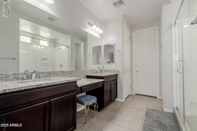 15276 W Latham St, Goodyear, AZ 85338 - bathroom featuring a shower stall, vanity, and tile patterned floors