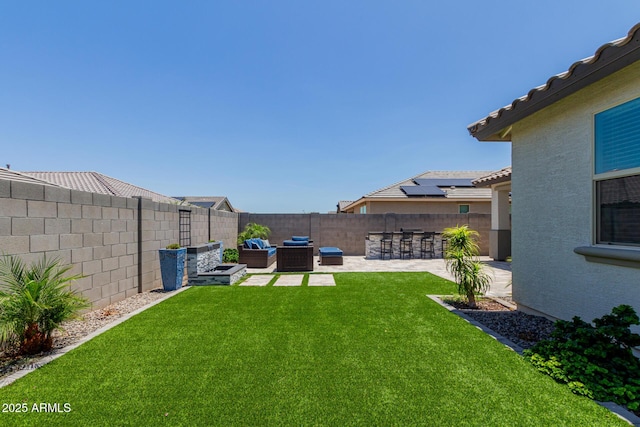 15276 W Latham St, Goodyear, AZ 85338 - fenced backyard featuring a patio and outdoor lounge area
