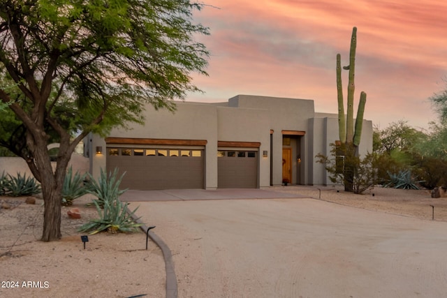 southwest-style home with a garage