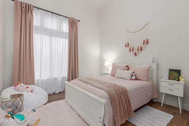 bedroom with light hardwood / wood-style floors