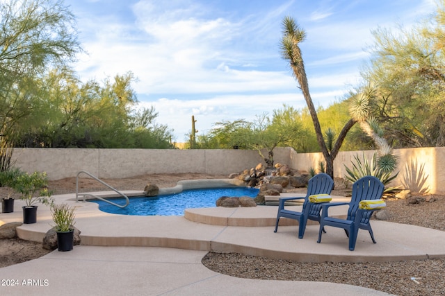 view of swimming pool with a patio area